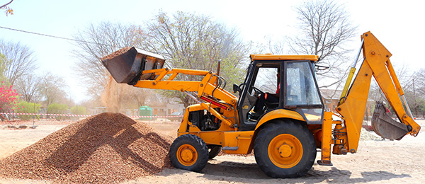 Tractor moving gravel Tractor Services