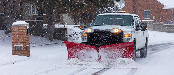 Snow Plowing truck in neighborhood Snow Plowing